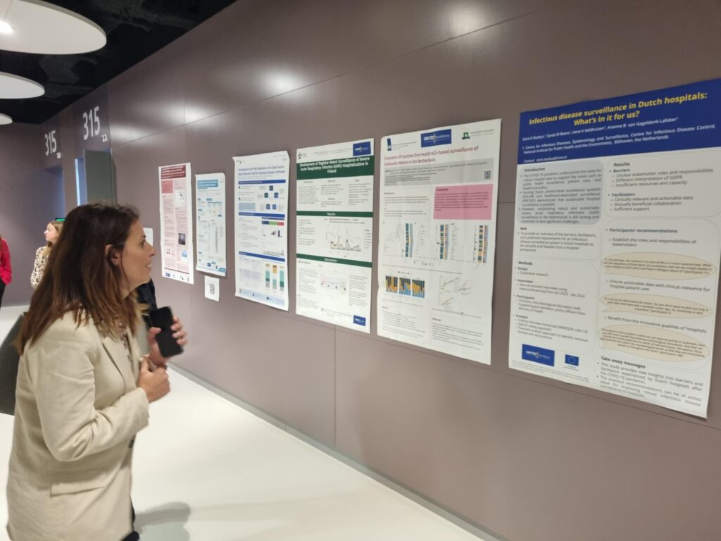 Person looking at the scientific posters